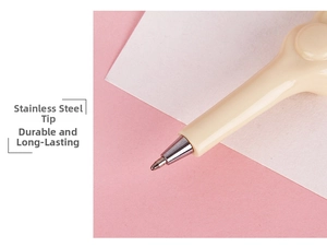 Macro view of a bone-shaped ballpoint pen featuring a durable stainless steel nib