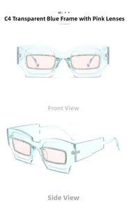 Detail view of transparent blue oversized sunglasses with rhinestones and pink lenses