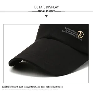 Close-up of shield logo embroidery and breathable cotton texture on black baseball cap