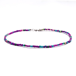 Detail of bohemian colorful seed bead choker necklace with silver lobster clasp closure