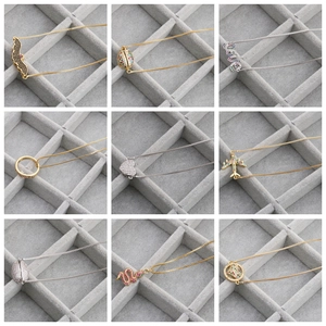 Detail of diverse gold and silver bracelets with micro-pave cubic zirconia charms