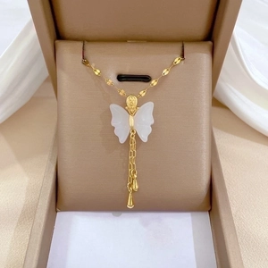 Exquisite gold-plated butterfly necklace with jade pendant and fringe tassel in a jewelry box