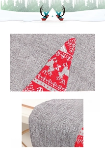 Close-up of Christmas table runner fabric featuring red knit reindeer and tree patterns