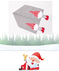 Detail of Christmas table runner featuring festive grey linen and Nordic gnome patterns