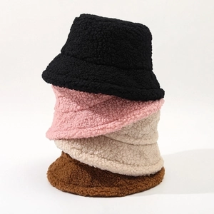 Lambswool bucket hats for winter in black, pink, beige, and brown teddy fur texture