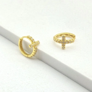 Macro shot of 18k gold plated S925 silver hoop earrings with zircon cross and hallmark