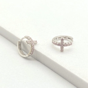 Detail shot of S925 sterling silver hoop earrings with pink zircon cross charms