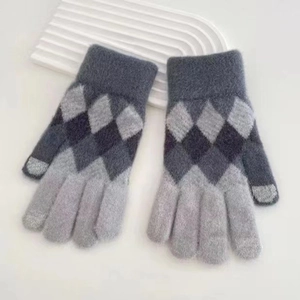 Detail of grey diamond pattern knitted gloves with touchscreen tips and ribbed cuffs