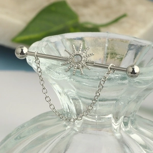 Silver stainless steel industrial barbell with sun motif, opal stone, and drape chain