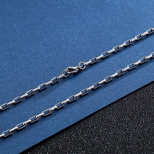 Polished silver stainless steel box chain necklace with lobster clasp close-up detail