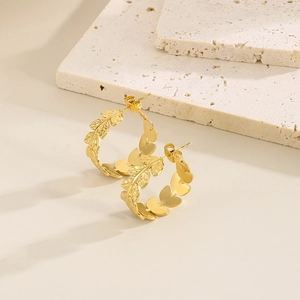 Golden titanium steel C-shaped hoop earrings featuring leaf textured engraved patterns