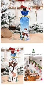 Detailed view of Christmas wine bottle covers with snowman and reindeer patterns