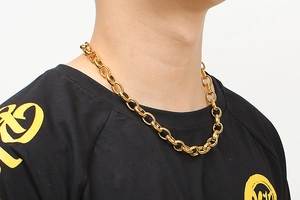 Close-up of a gold stainless steel chunky O-chain necklace on a female model neck