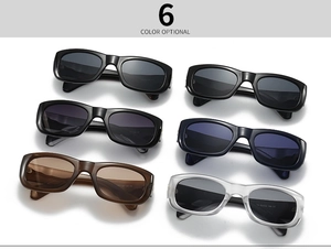 Top view of six colorful square sunglasses including black and brown on white background