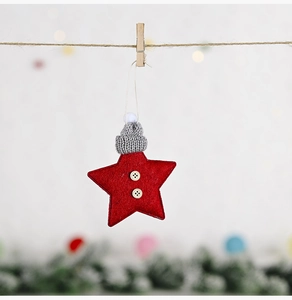 Close-up of red felt star ornament with grey knit hat and wooden buttons detail
