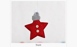 Macro detail of red star felt ornament with grey knit hat and wooden buttons decor