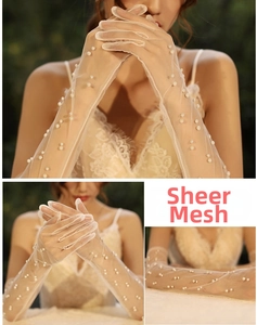 Close-up of white sheer mesh bridal gloves with elegant faux pearl embellishments