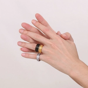 Set of spinner rings with sun moon star engraving in gold black and silver steel