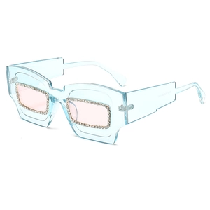 Women's light blue geometric sunglasses with rhinestones and pink lenses