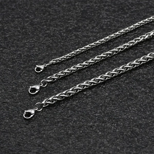Three silver stainless steel curb chains in various thicknesses on black background