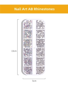 Detailed size view of a 12-grid nail art storage box with AB crystals and white rhinestones