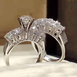 Two-piece silver zircon ring set with a large round center stone and micro-pave accents