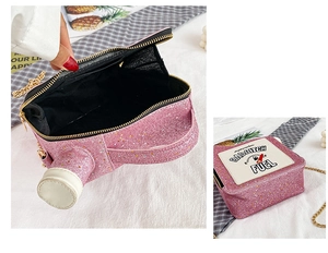 Detail of pink sequin oil can handbag with BAD BITCH FUEL embroidery and gold chain strap