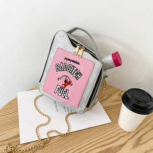 Close-up of sequin oil drum handbag with Superpremium Badbitch Fuel lettering