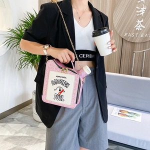 Pink sequin oil-can shaped handbag featuring badbitch fuel embroidery and chain