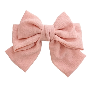 Elegant large layered pink fabric bow hair clip for women with premium textured finish