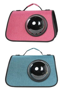 Detail of portable pet carrier with clear bubble window and mesh ventilation holes