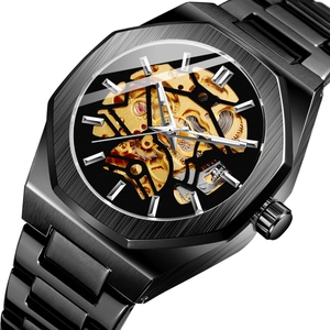 Detail shot of the golden skeleton movement and black polygon case of this mechanical watch