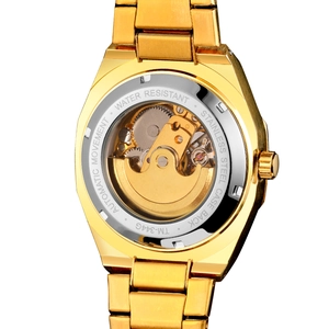 Macro shot of transparent case back showing automatic mechanical movement of model TM-344G