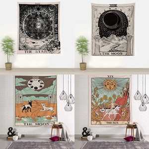Detail of four tarot card tapestries featuring Sun, Moon, and Star in bohemian room decor