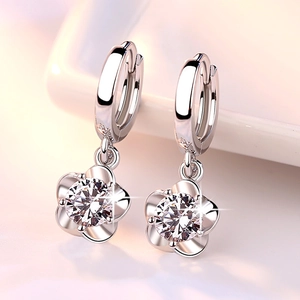 Minimalist silver flower hoop earrings with zircon stones and polished petal design