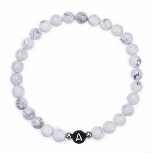 Natural 6mm white turquoise beaded bracelet with letter A charm on a clean white background