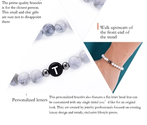 Close-up of 6mm white marble turquoise beads and custom initial letters on elastic bracelet