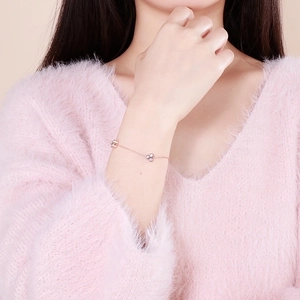 Elegant rose gold clover bracelet with sparkling diamonds on a delicate chain for women