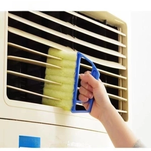 Close-up of 5-layer microfiber cleaner brush removing dust from air vent shutters