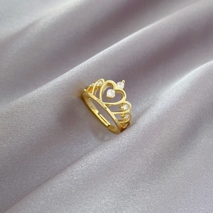 Adjustable golden crown ring with hollow heart patterns and sparkling rhinestones