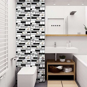 Self-adhesive PVC wall tiles with black, white, and grey marble texture in a bathroom