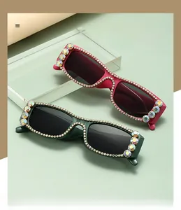 Detail of square polarized sunglasses with sparkling rhinestones on the frame edges
