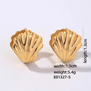 Detailed view of golden shell earrings with polished finish and product dimensions