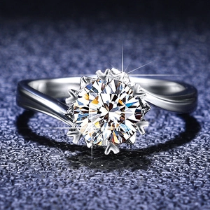 Macro shot of snowflake moissanite ring with twisted band and classic six-prong setting