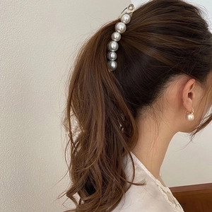 Elegant pearl banana hair clip and matching gold earrings set for sophisticated styling