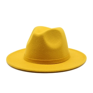 Detail view of bright yellow wool fedora hat with matching decorative ribbon band