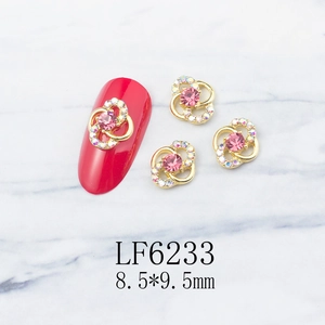 Macro shot of LF6233 flower nail art charms with pink stones and tiny crystal petals