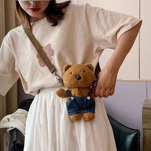 Cute brown plush bear crossbody bag with blue denim overalls and adjustable strap
