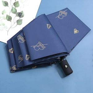 Automatic foldable navy blue umbrella with golden heart prints and one-button handle