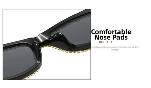 Close-up of integrated nose pads on black square sunglasses with gold rhinestone trim